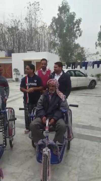 Distributed wheels chairs to Poor people