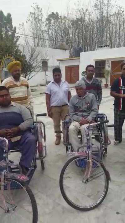 Distributed wheels chairs to Poor people