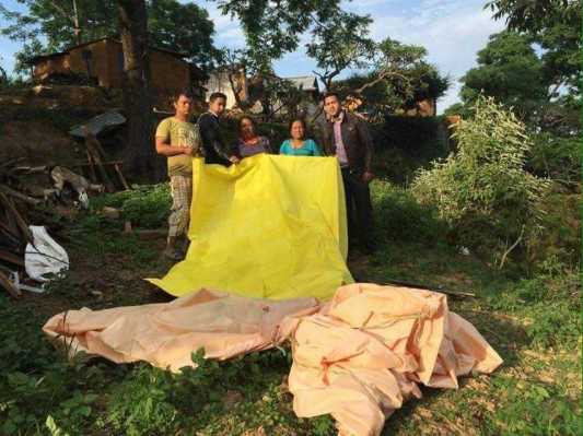 Johnatthan and team provide tents to people.